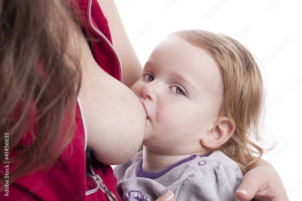 Little girl eating milk