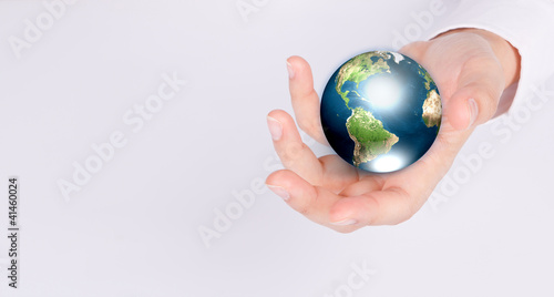 Hands with earth (Elements of this image furnished by NASA)