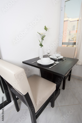 Small dining table in an apartment © Paul Vinten