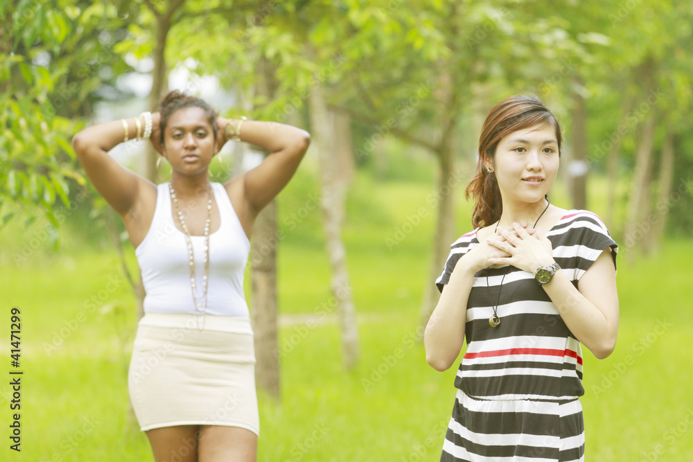 Fototapeta premium Two different races woman, black and asian.