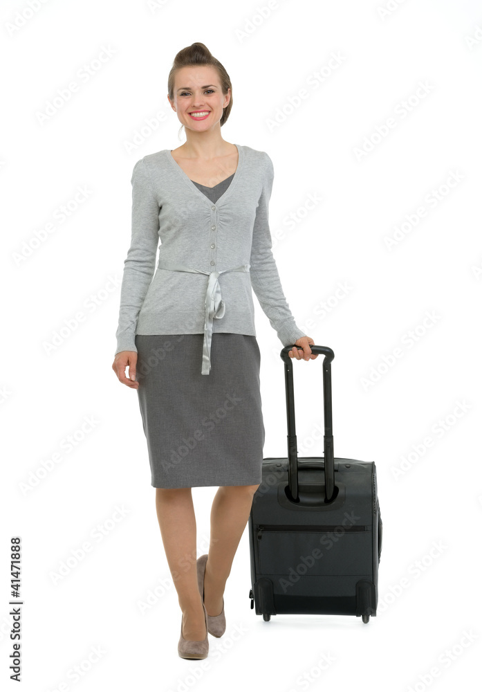 Happy traveling woman with suitcase making step forward Happy traveling woman with suitcase making step forward