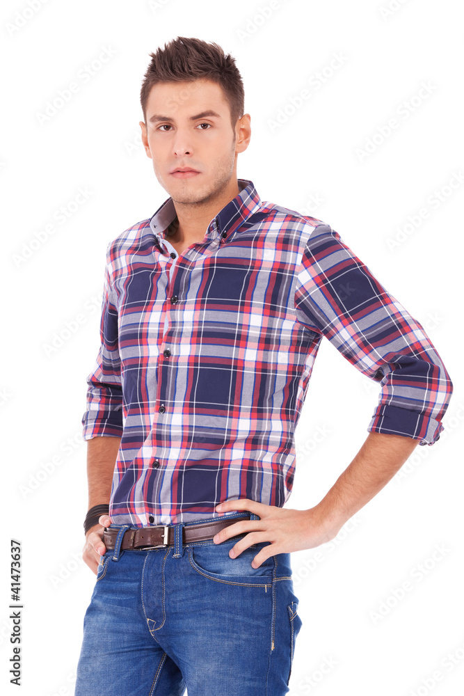 casual man standing with hands on hips casual man standing with hands on hips