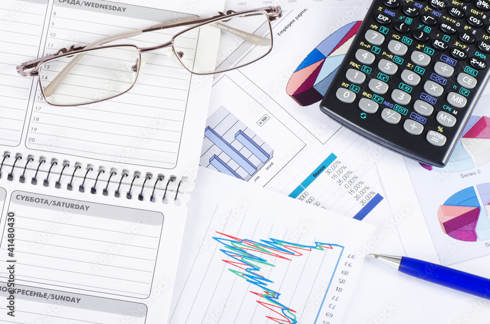 Graphs, charts, business table. The workplace of business people Graphs, charts, business table. The workplace of business people