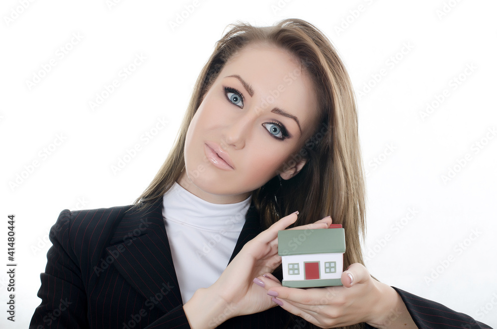 The business woman with small model of the house The business woman with small model of the house