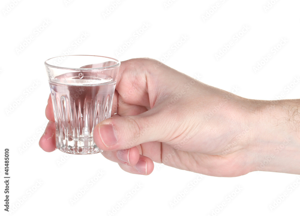 Man's hand holding a glass with vodka isolated on white Man's hand holding a glass with vodka isolated on white