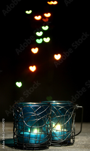 Beautiful candle and decor on wooden table on bright background