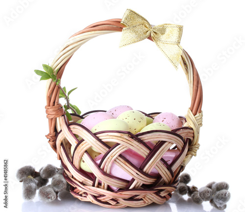 basket with Easter eggs and pussy-willow twigs isolated on