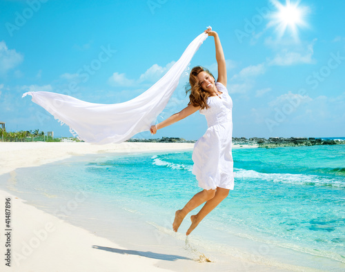 Beautiful Girl Having Fun on the Beach photo