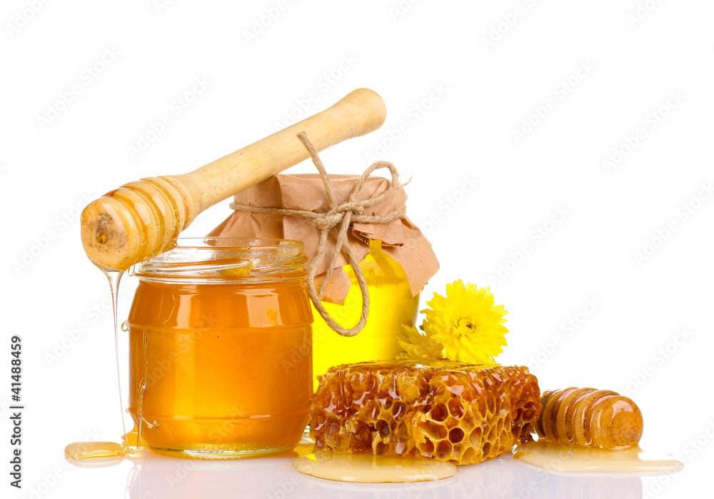 two jars of honey, honeycombs and wooden drizzler isolated two jars of honey, honeycombs and wooden drizzler isolated