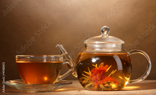 glass teapot and cup with exotic green tea