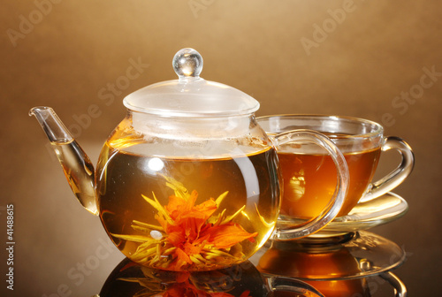 glass teapot and cup with exotic green tea