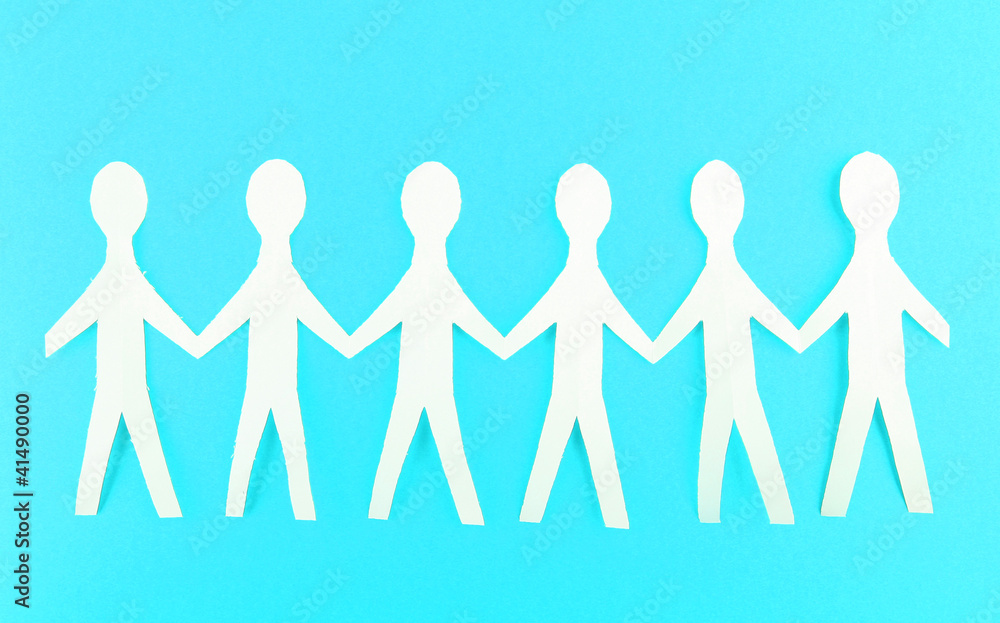 Paper people on blue background Paper people on blue background