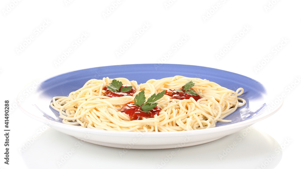 Italian spagetti cooked with tomato sauce in a blue plate Italian spagetti cooked with tomato sauce in a blue plate