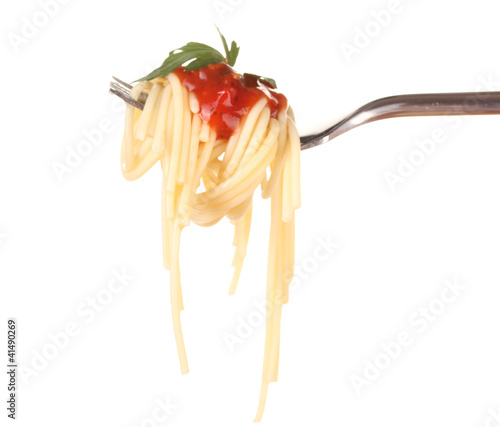 Delicious spaghetti on a fork close-up on white background