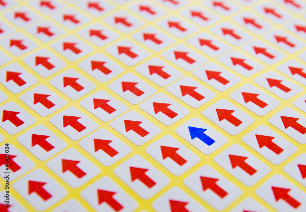 blue arrow stands out of red arrows blue arrow stands out of red arrows