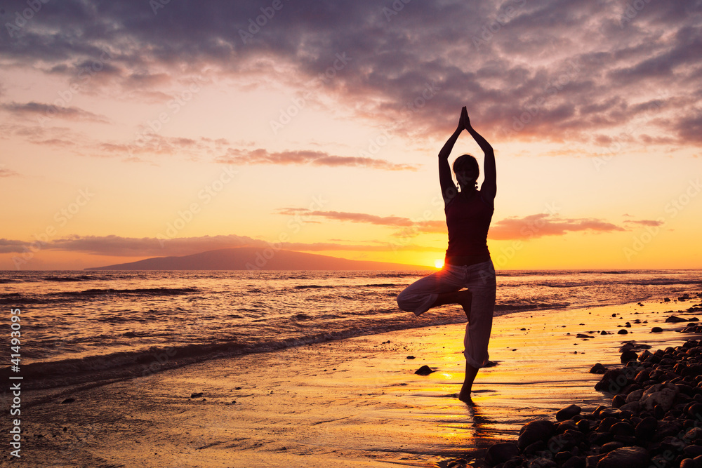 Silhouette of a Beautiful Yoga Woman at Sunset