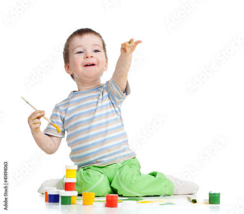 kid drawing with paints poi...