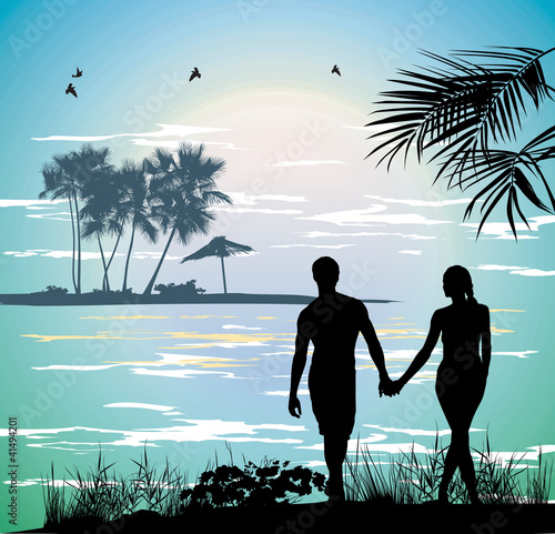 couple holding hands on the beach going on the ocean