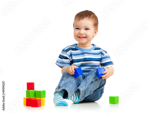 kid playing toy blocks
