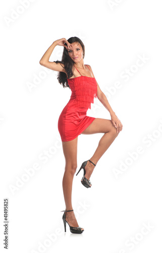 Portrait of a beautiful young woman in red dress.
