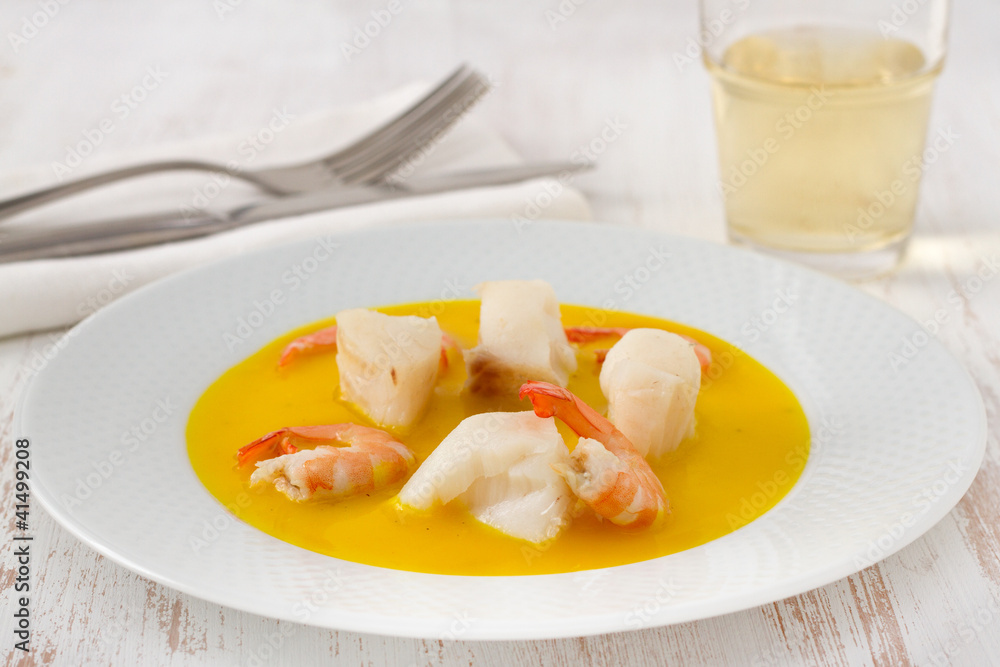 fish with shrimps in sauce on the plate fish with shrimps in sauce on the plate