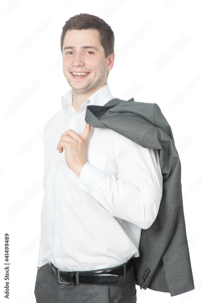 Happy young businessman stands with his jacket over his shoulder Happy young businessman stands with his jacket over his shoulder