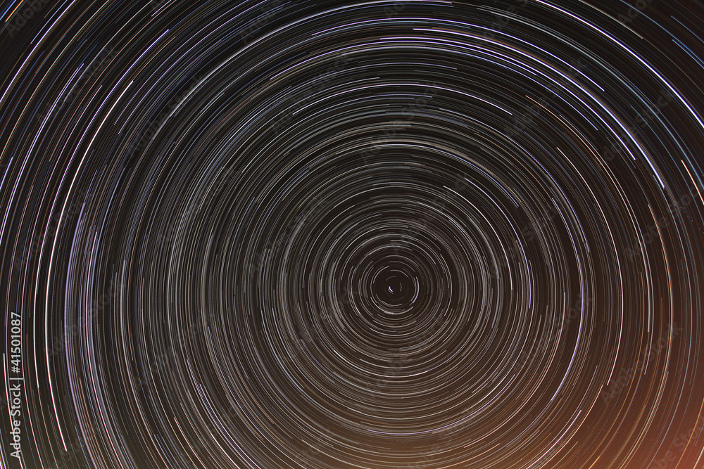 Cumulative time lapse of star trails in night sky. Cumulative time lapse of star trails in night sky.