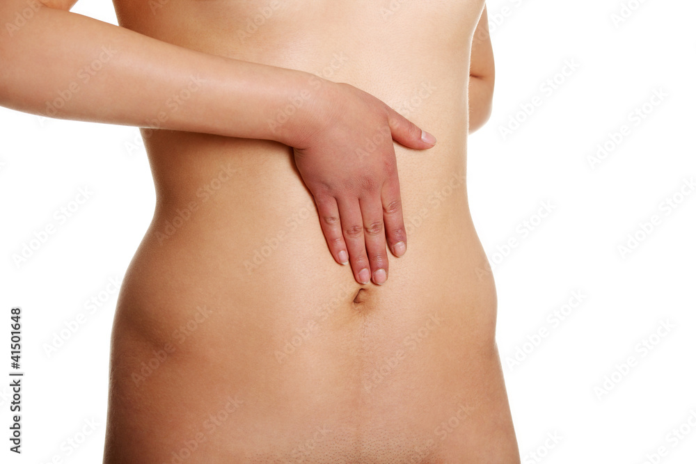 Nude woman with hand on her belly Nude woman with hand on her belly