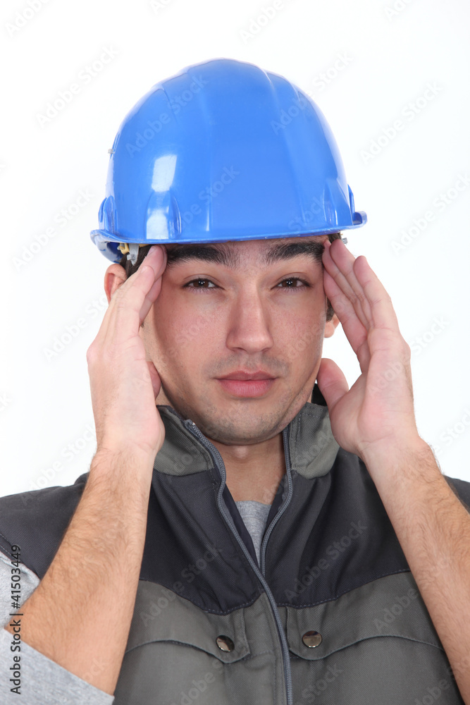 workman having migraine workman having migraine