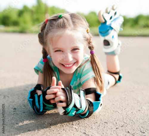 Little girl in roller skates photo