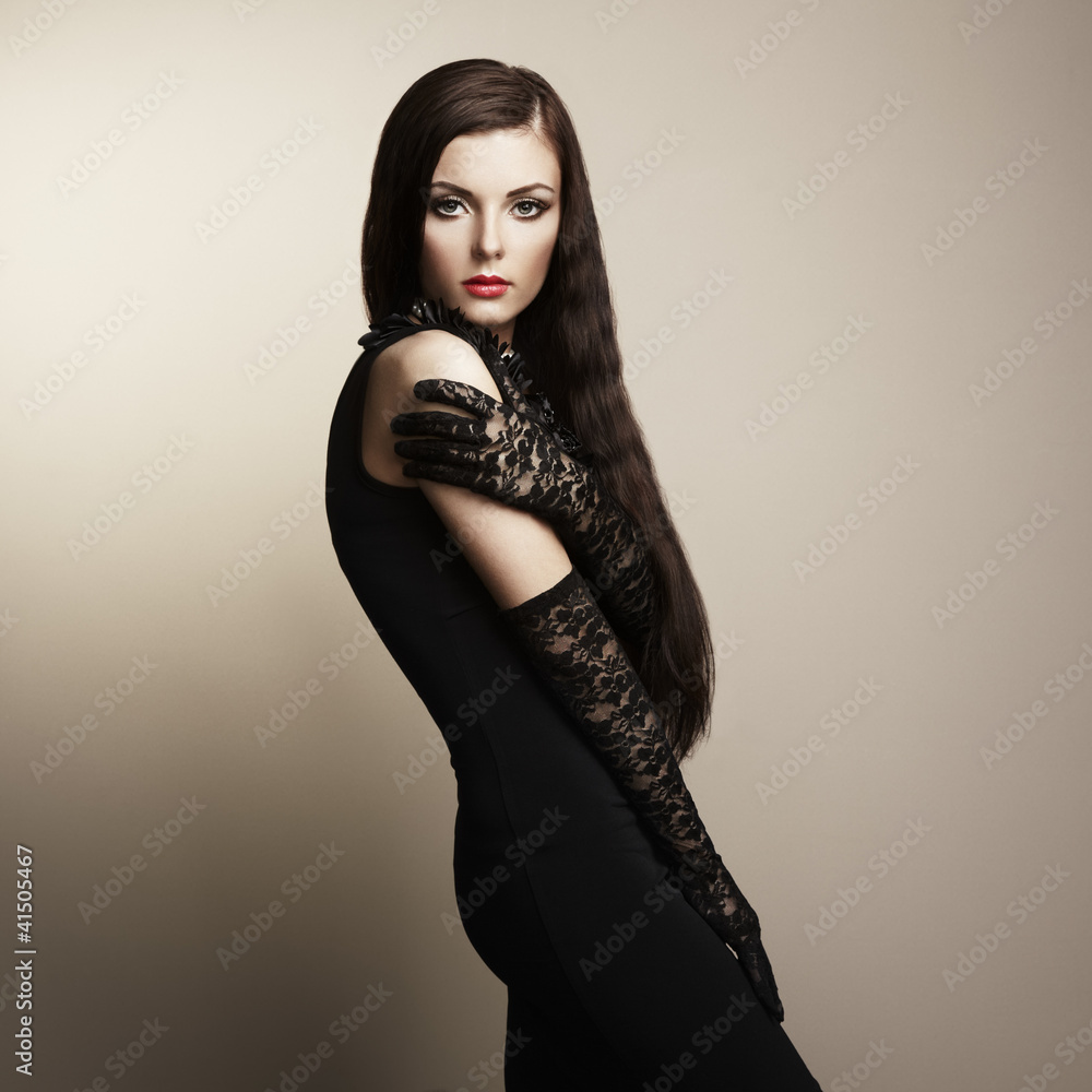 Fashion portrait of young beautiful woman in the black dress Fashion portrait of young beautiful woman in the black dress