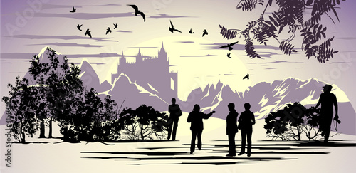 Tourists walk in the park near the ancient castle