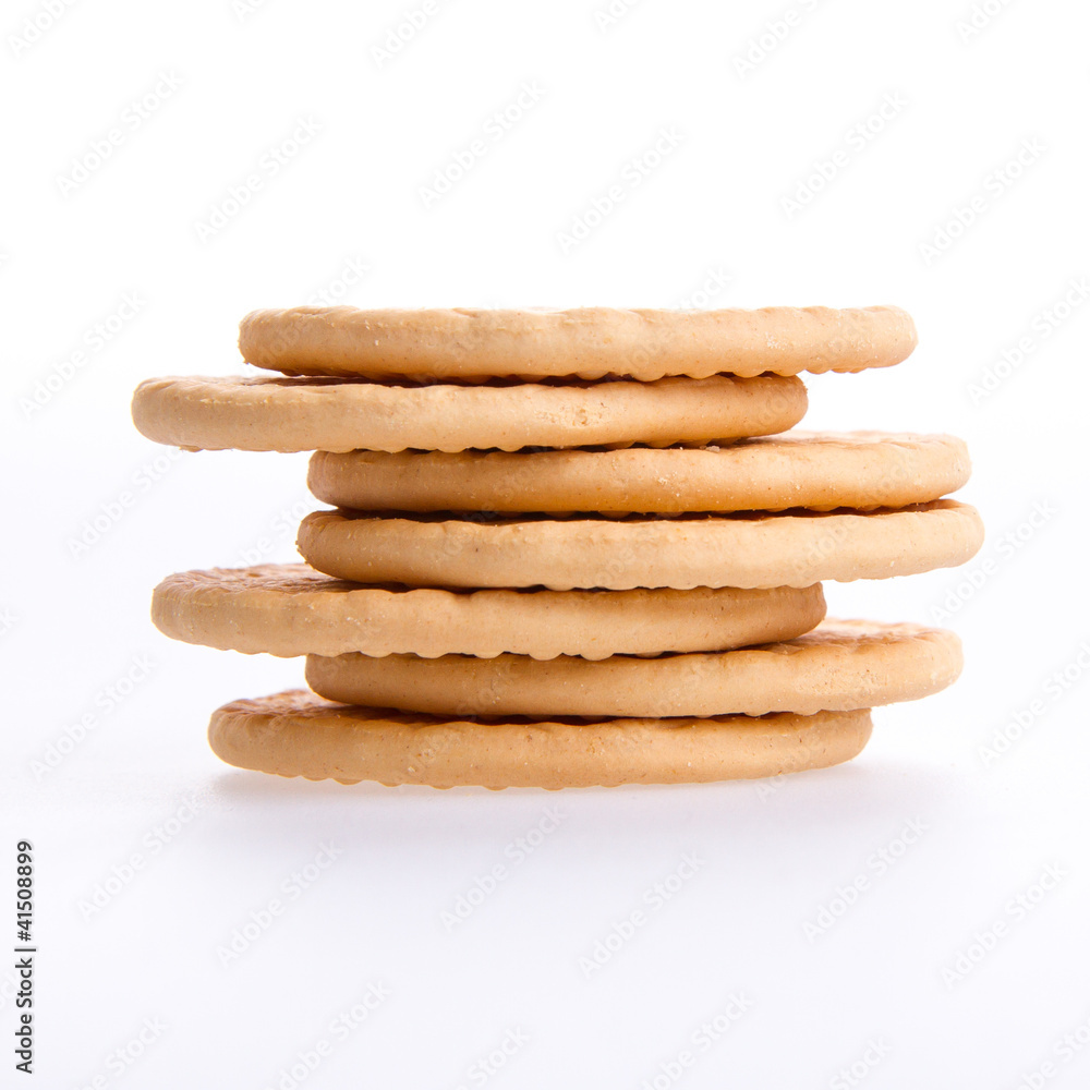 A stack of round biscuits on a grey background A stack of round biscuits on a grey background
