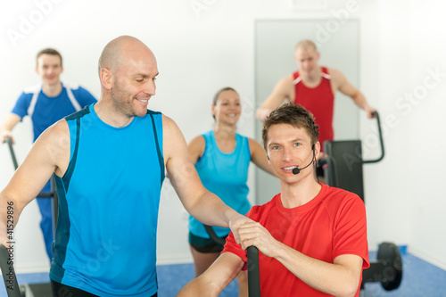 Young fitness instructor lead class alpinning