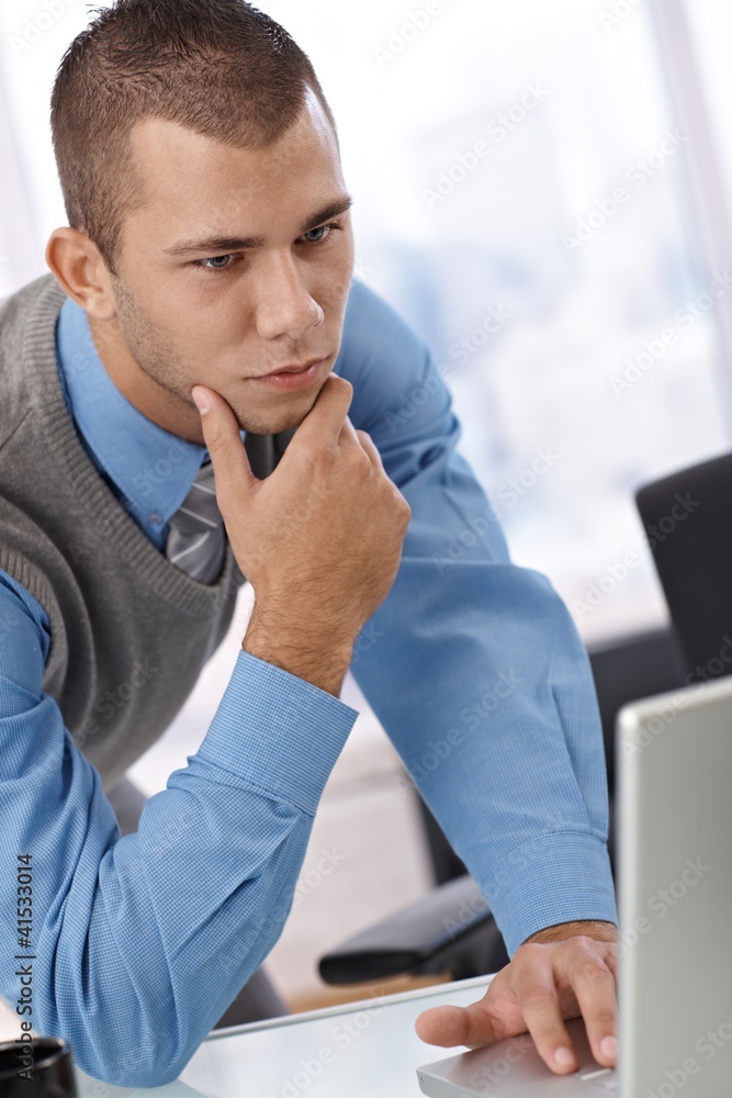 Fototapeta premium Businessman thinking at work