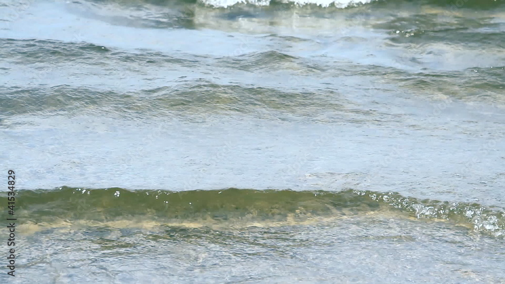 waves touching sandy beach waves touching sandy beach