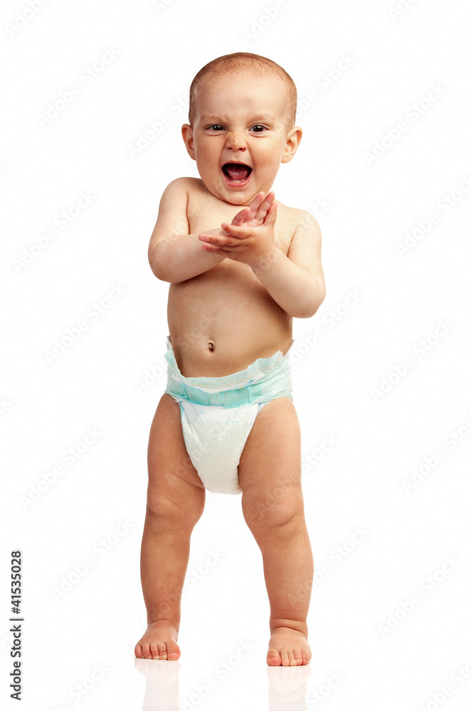 Cute one-year old boy clapping hands in studio Cute one-year old boy clapping hands in studio