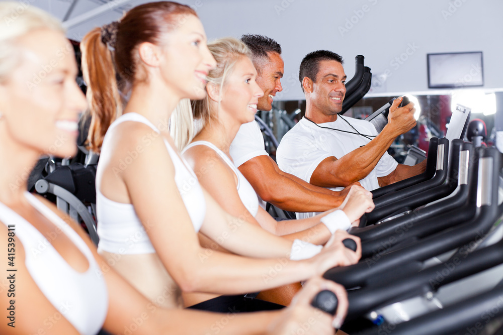 sport coach training cyclists in gym sport coach training cyclists in gym