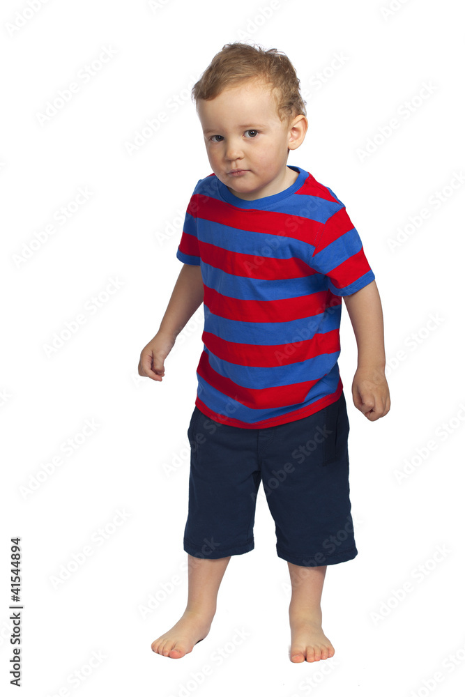 Little boy shyly looking at photographer, isolated Little boy shyly looking at photographer, isolated