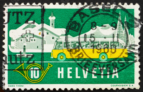 Postage stamp Switzerland 1953 Alpine Post Bus, Winter Backgroun photo