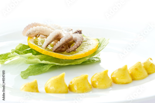 boiled octopus with lemon slice