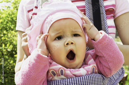 Portrait of a child yawning photo