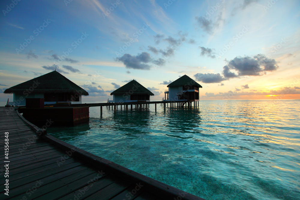 maldivian houses on sunrise