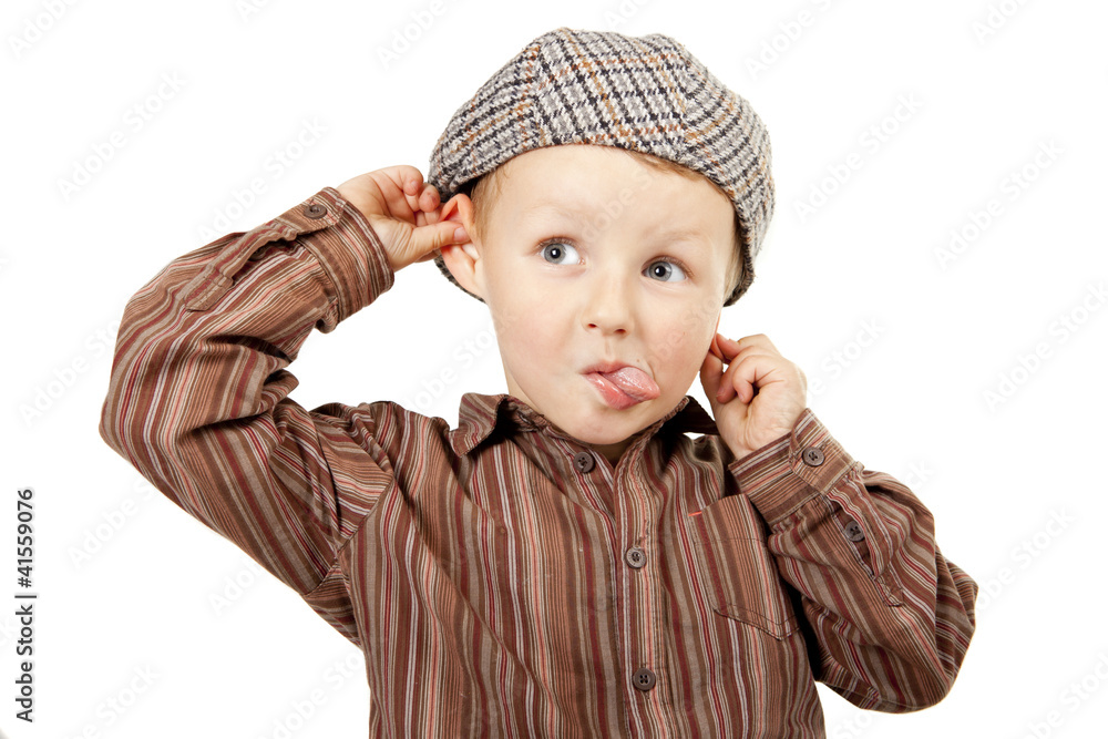 A portrait of a little urchin. Boy shows tongue... A portrait of a little urchin. Boy shows tongue...