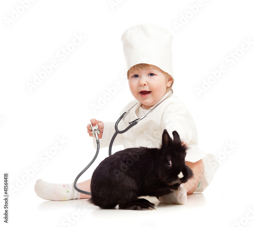 Adorable kid doctor with pet