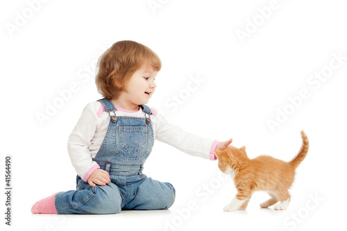 kid playing wit cat