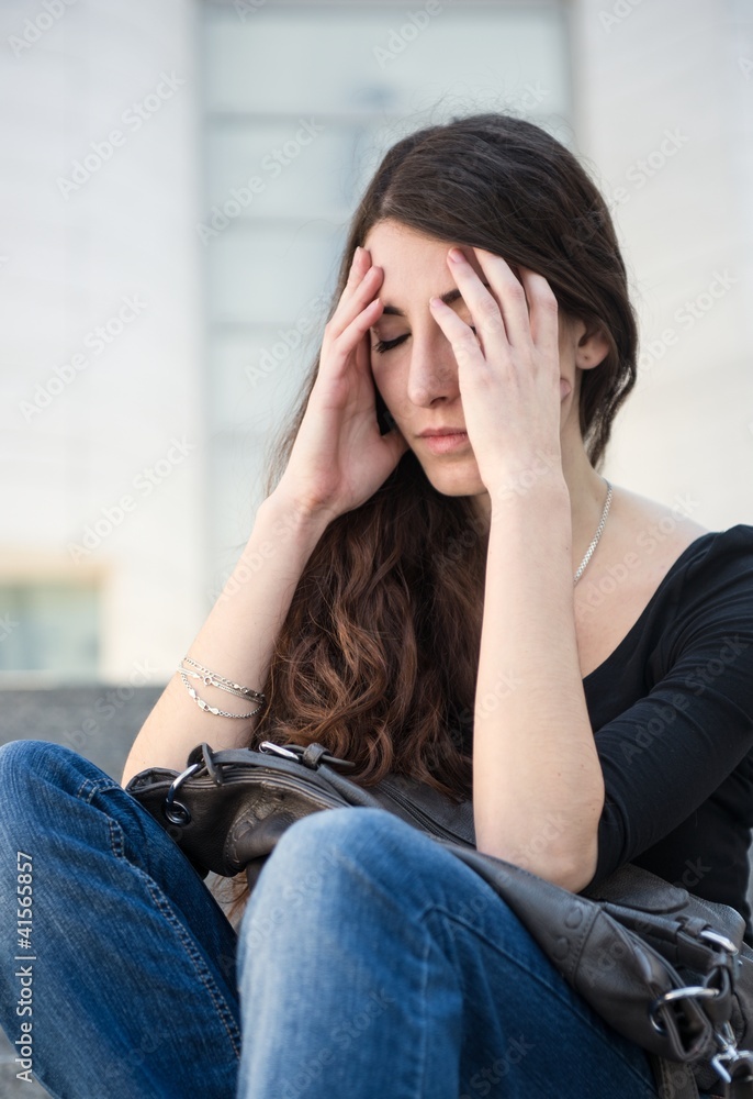 Headache and problems - young woman outdoor Headache and problems - young woman outdoor