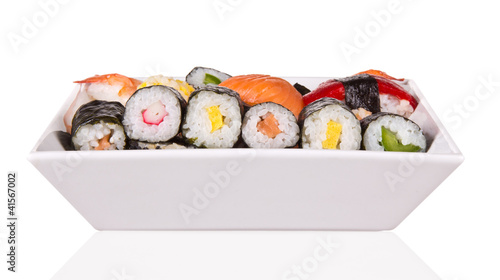 Sushi on plate, isolated on white background