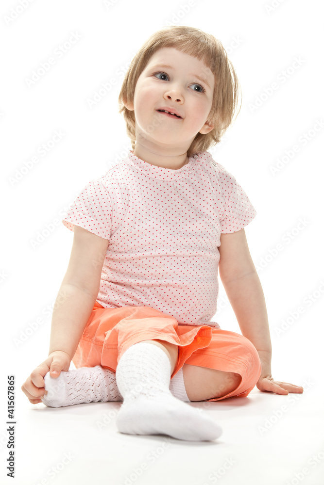 Portrait of a child sitting on the floor Portrait of a child sitting on the floor