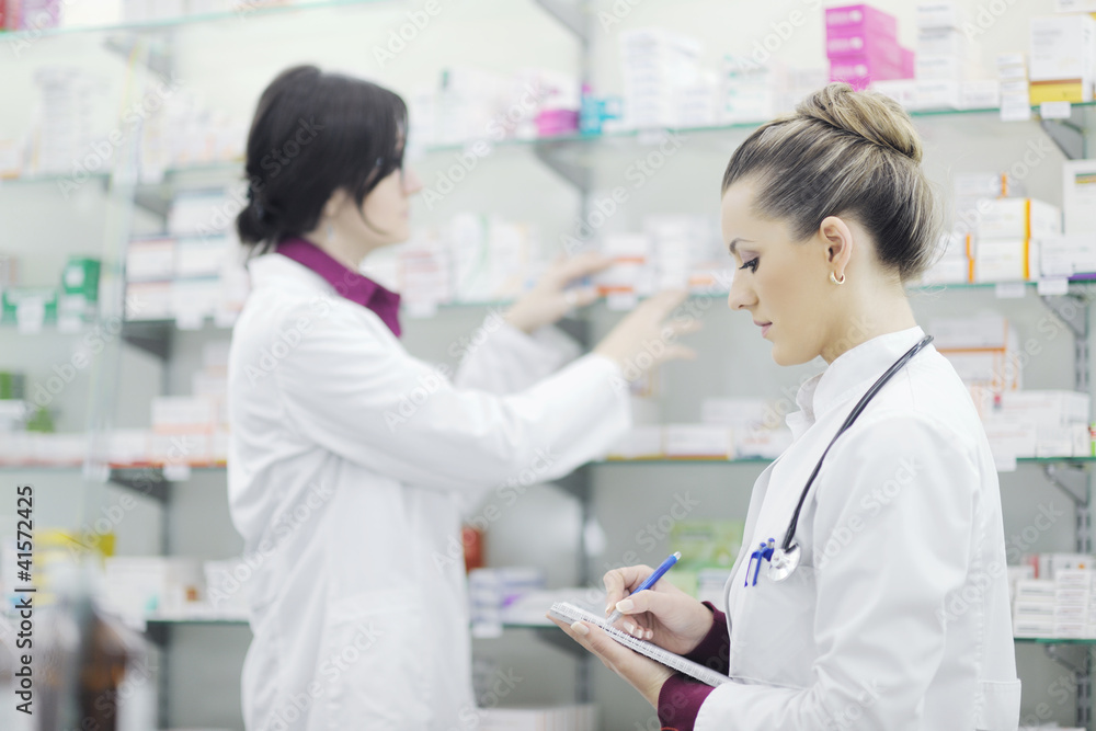 team of pharmacist chemist woman in pharmacy drugstore team of pharmacist chemist woman in pharmacy drugstore